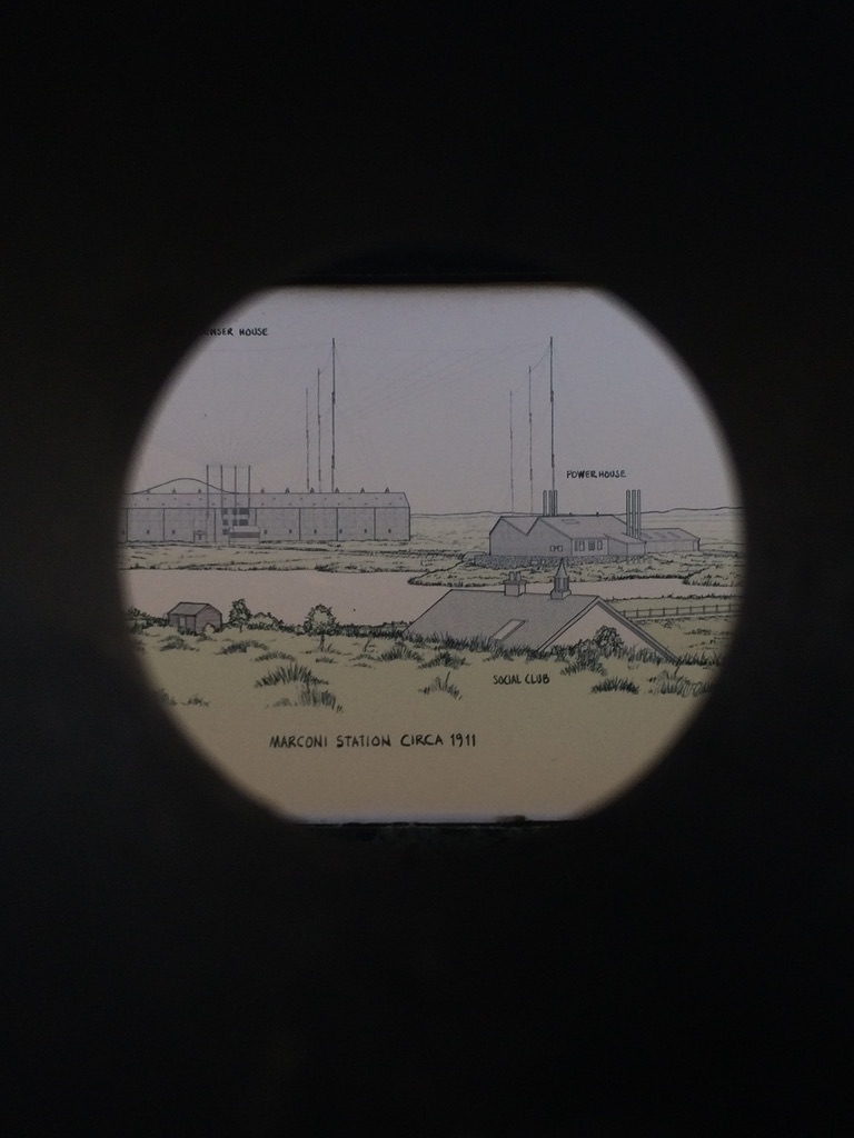 Photo by Frank Monahan of a drawing of the Marconi Wireless Station, seen through a circular viewfinder.