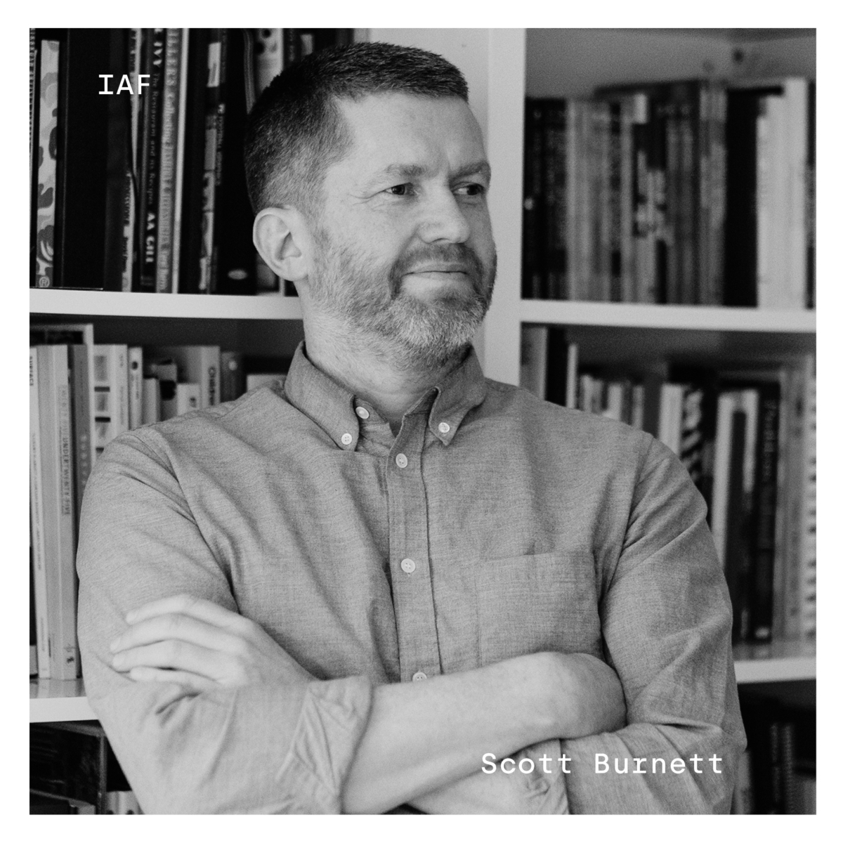 Black and white profile of Scott Burnett. His name is in white in the bottom right corner, and "IAF" in white in the top left corner.